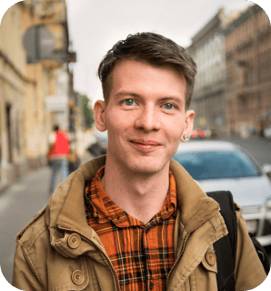 Man standing in a high street environment