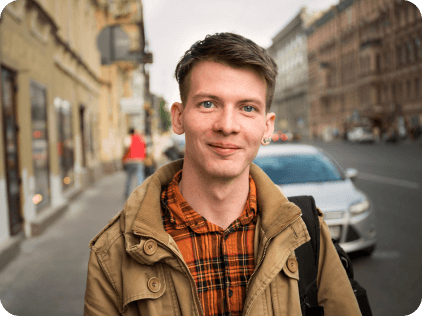 Man standing in a high street environment