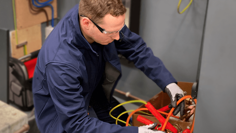 Man using electrical cables