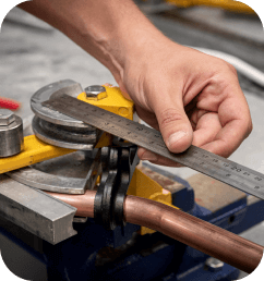 Man measuring a pipe